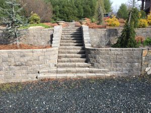 custom stone stairs and a retaining wall installed by Premier Landscape